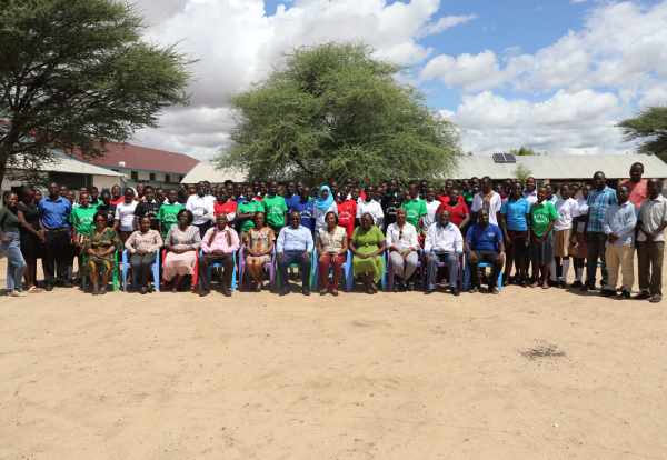 The-team-composed-of-the-girls,-mentors-and-the-cordintor-pose--for-a-group-photo-with-the-chief-guest