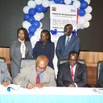 MOE-CS-and-KNATCOM-Board-Chair-Signing-the-PC